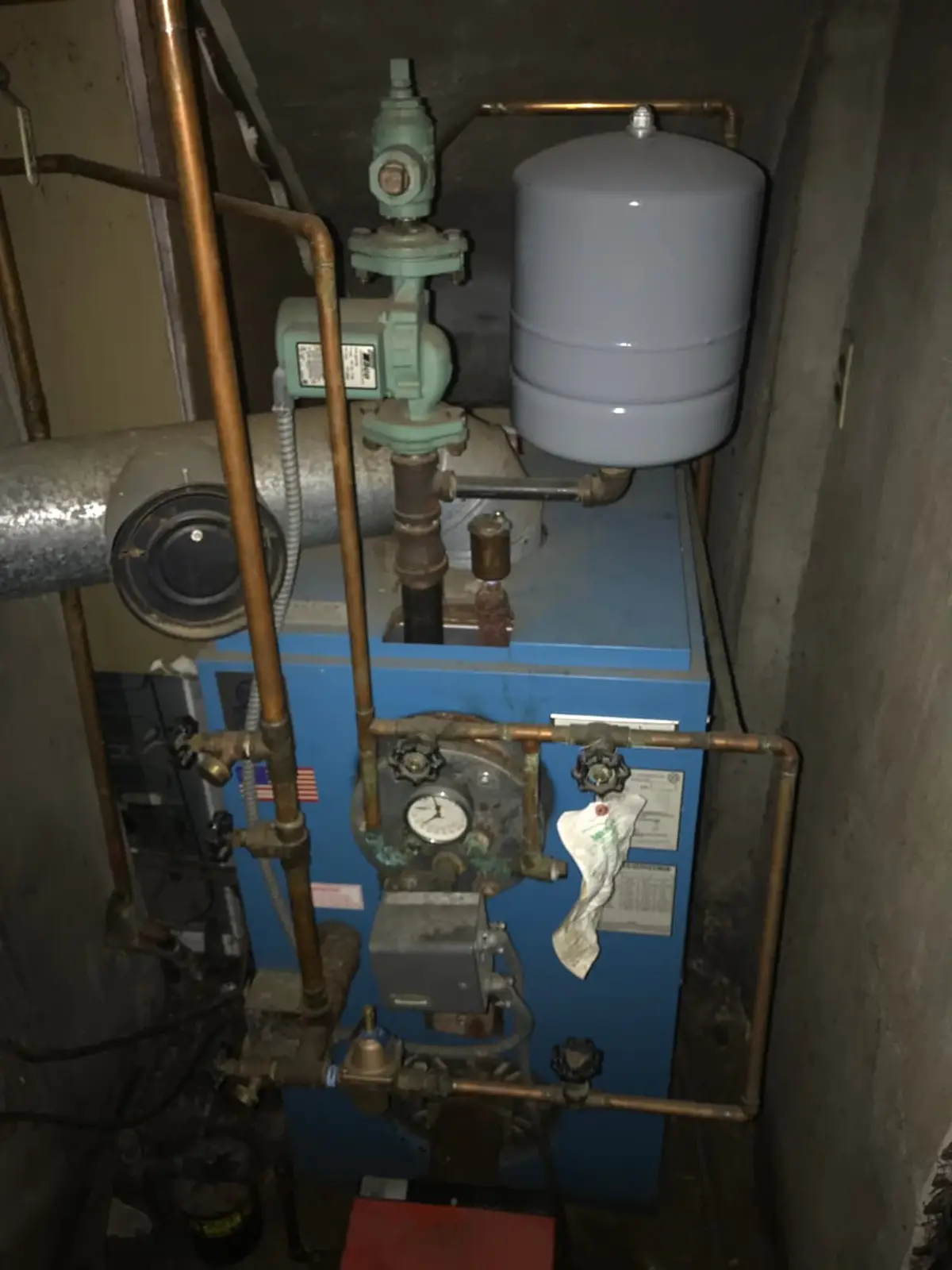 Selling a house with multiple heirs in Levittown: old boiler and copper piping in a utility closet